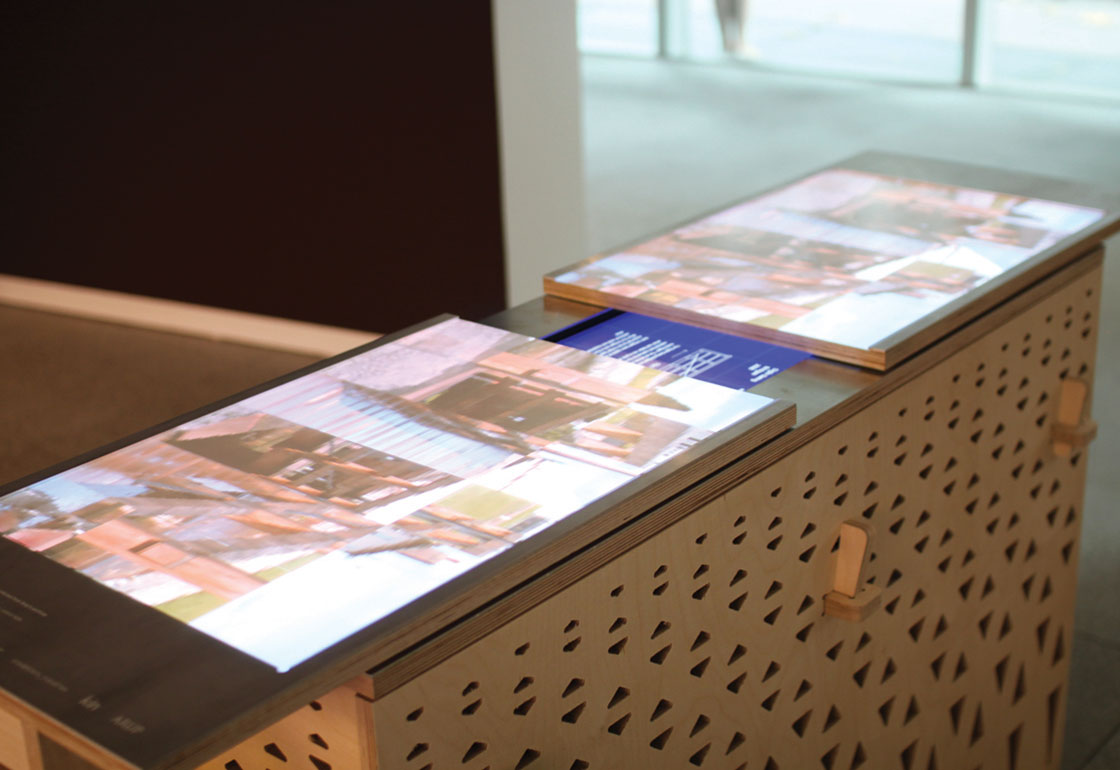 2 screen surfaces on a wooden structure