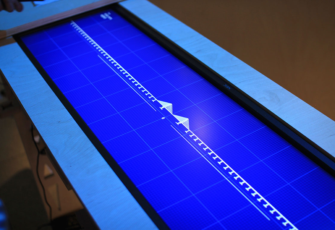 A long screen showing a blueprint of a long bridge