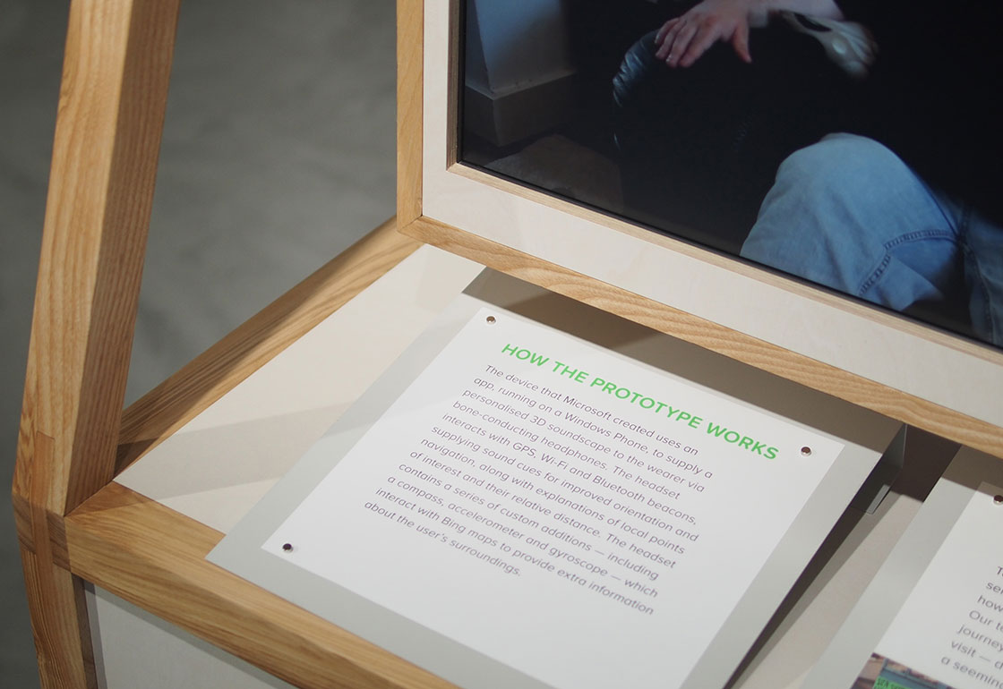 Exhibtion stand with wood framed screen and graphic panel