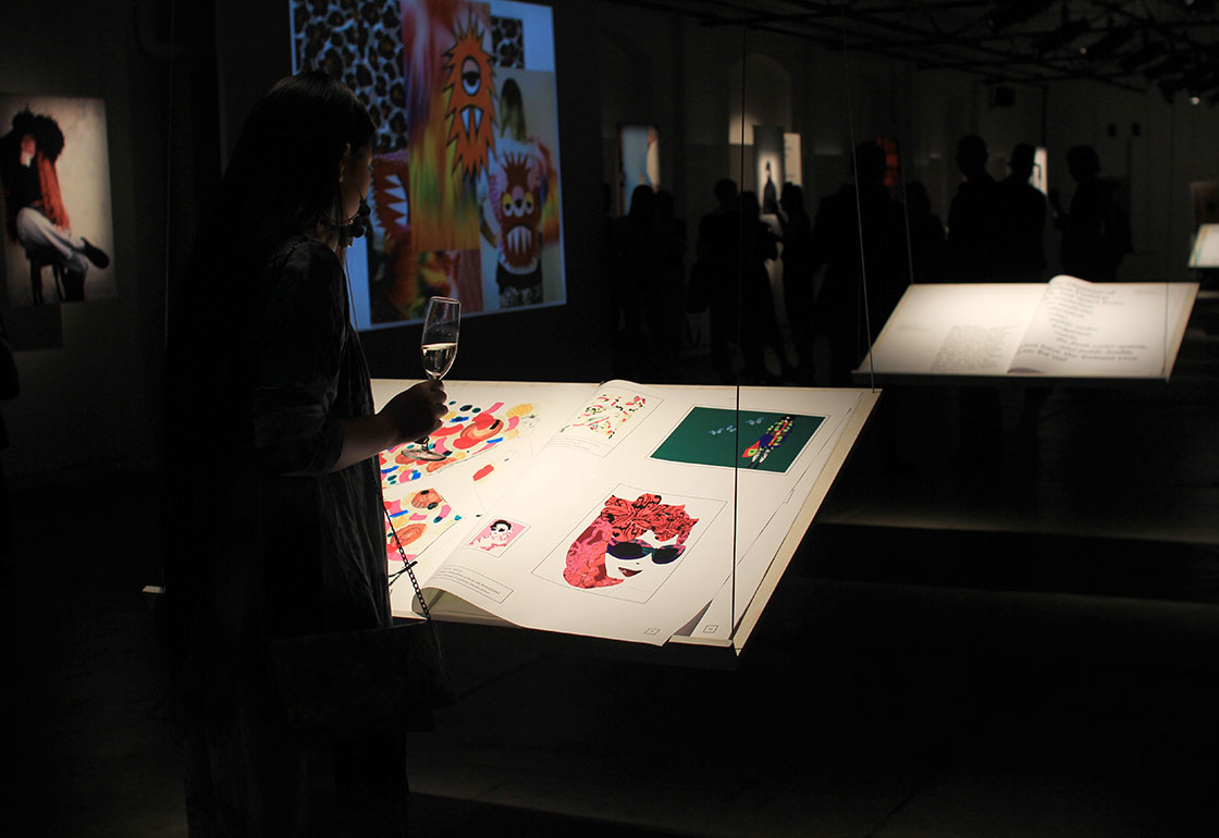 Large books on hanging stands