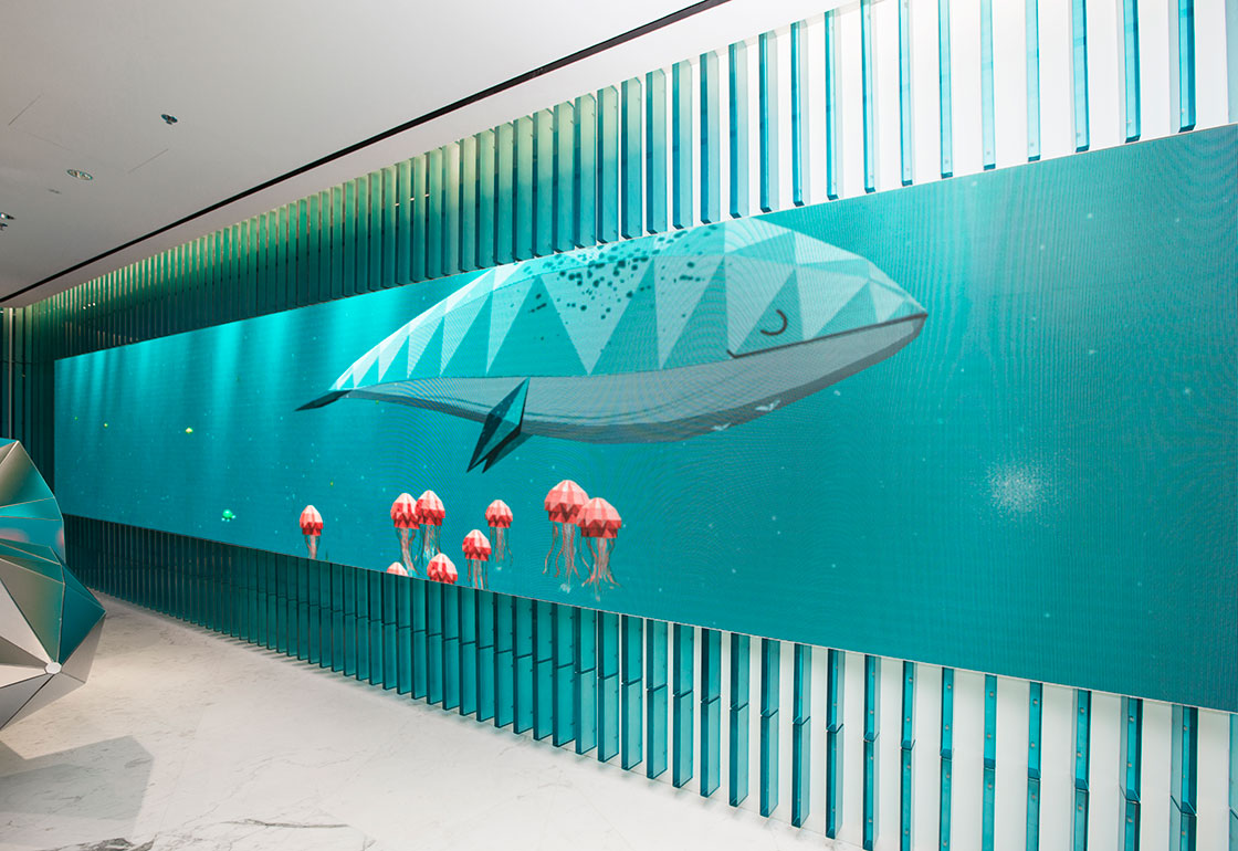 An animated whale on a large screen