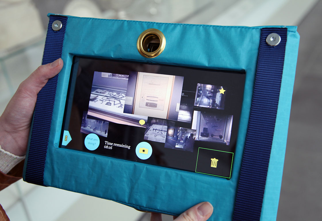 A digital tablet wrapped in a sailcloth cover