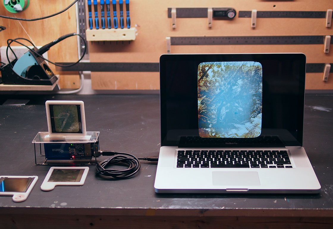 Prototype model showing with lantern slides and a laptop screen