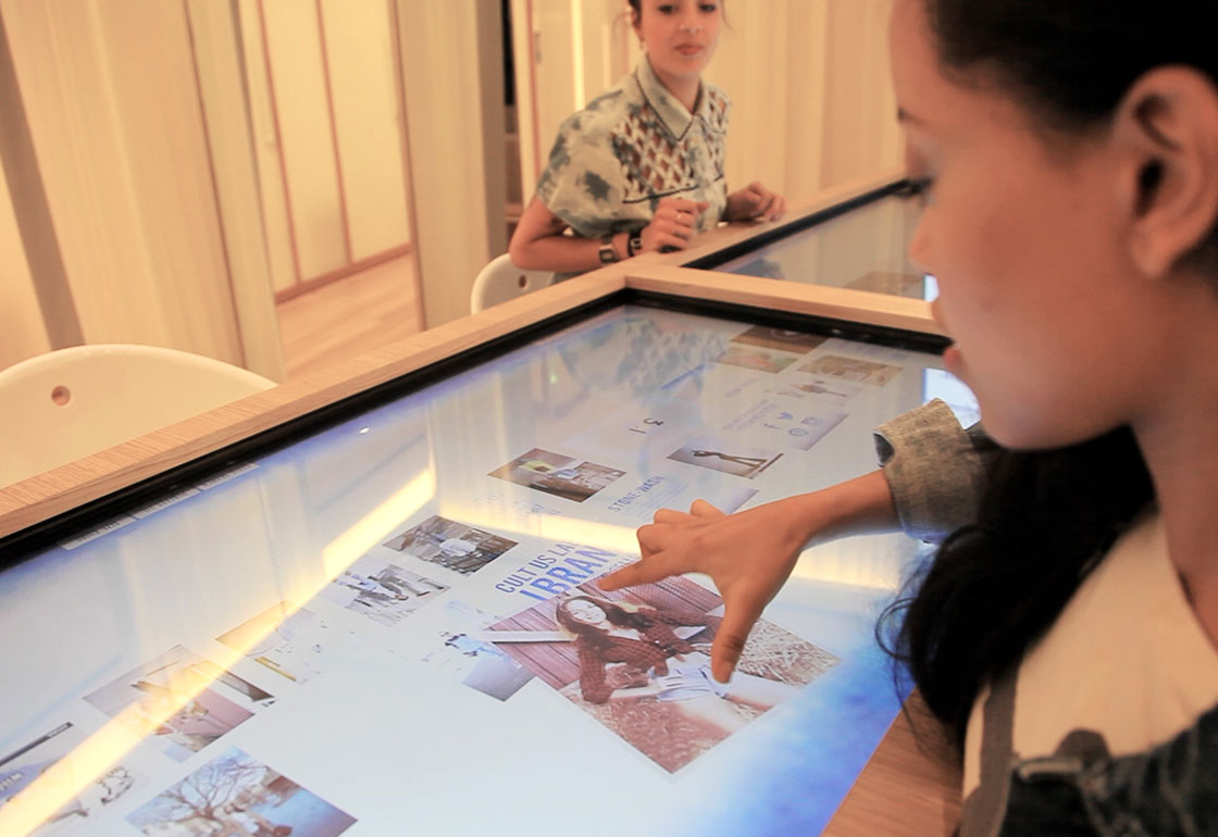 A customer interacting with the touchscreen